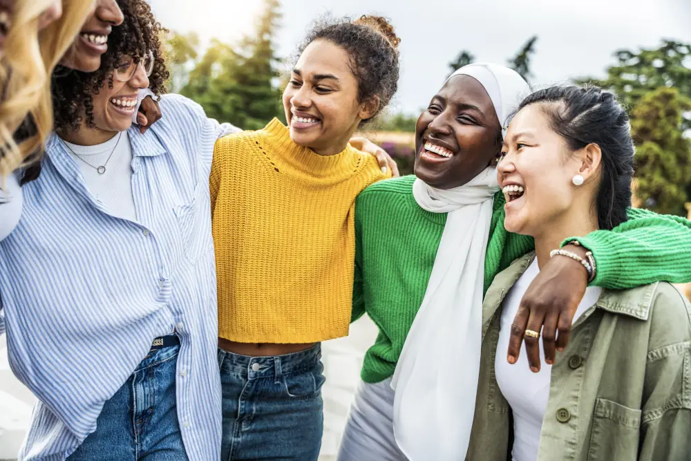 Group Of Young Women Hugging